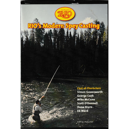 photo of man standing in river fishing